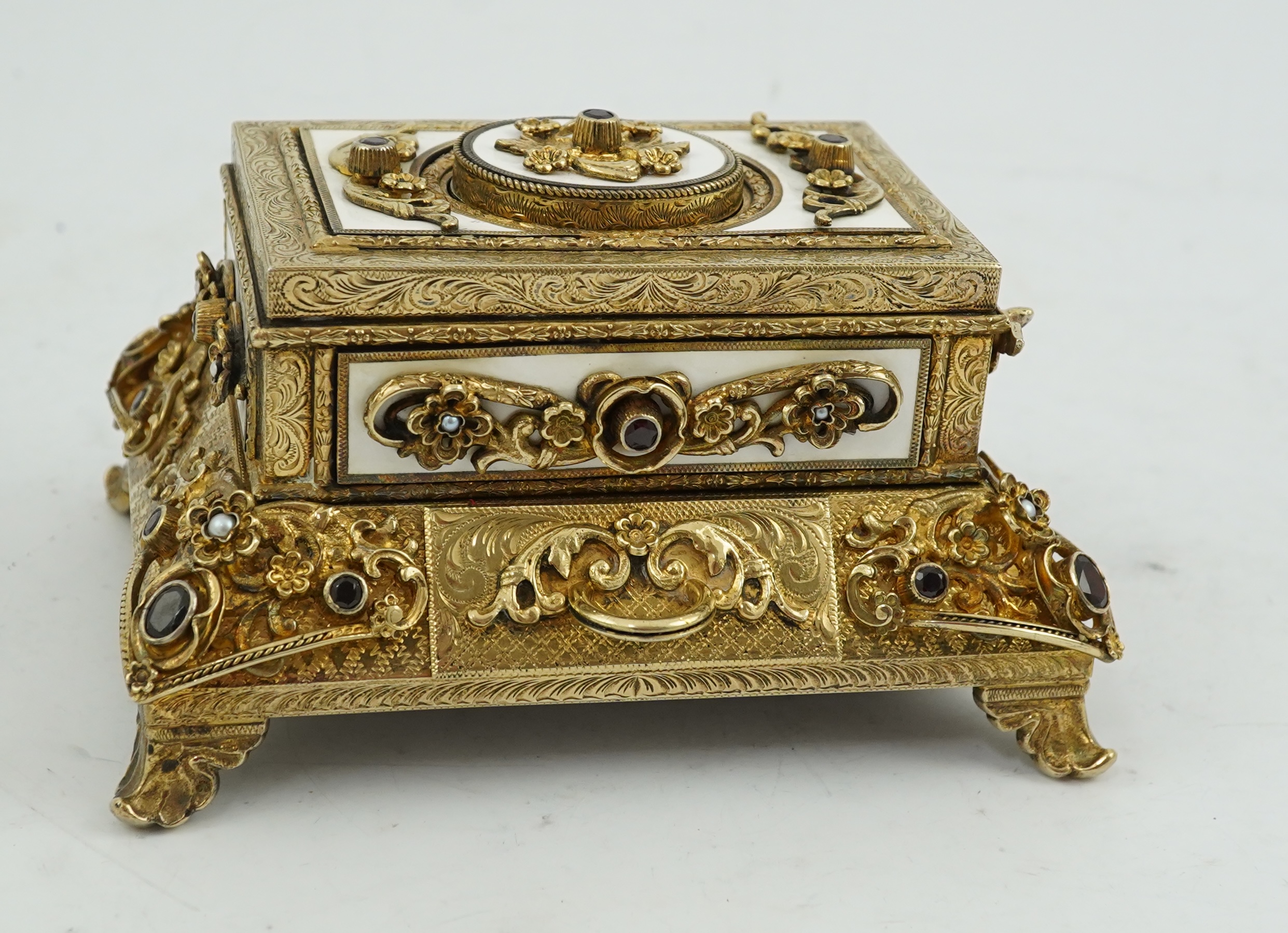 A late Karl Griesbaum Model 17 silver gilt, white enamel, garnet and cultured pearl set automaton singing bird box